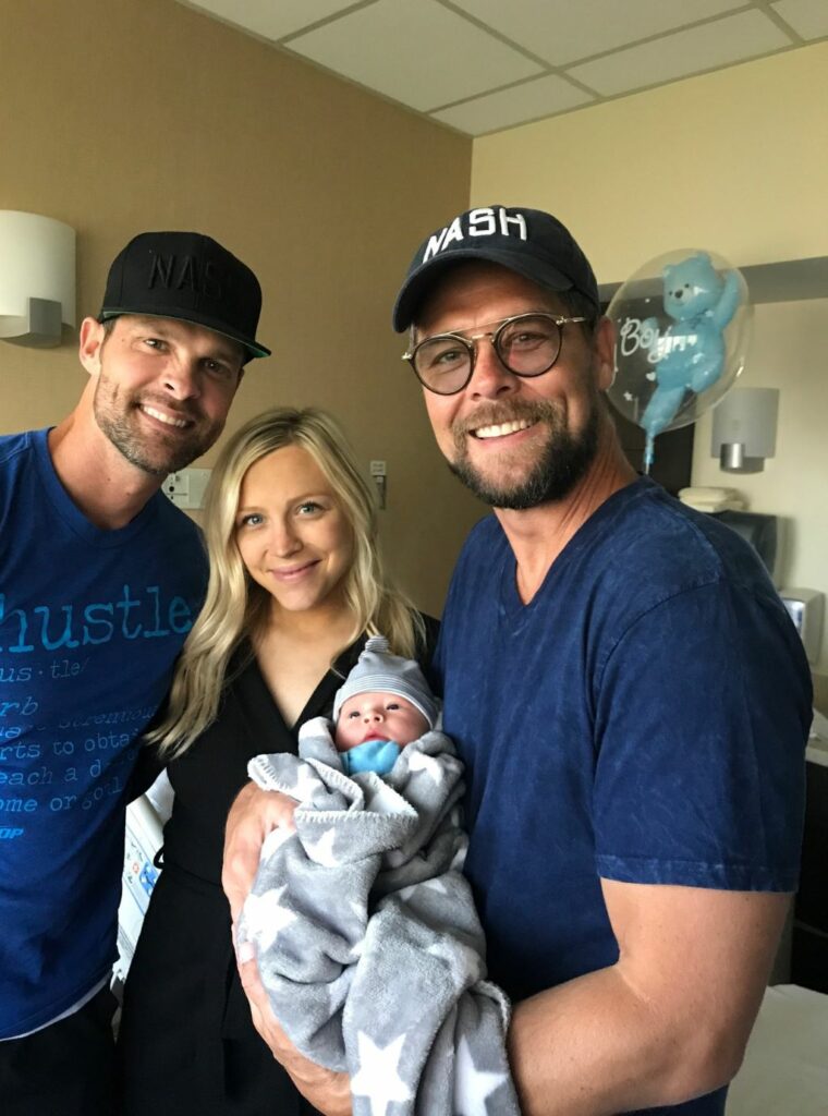 Adam Crabb with his wife and baby Image
